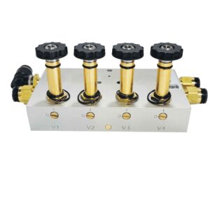 A front-facing view of an air dryer valve block manifold against a white background. The rectangular silver aluminum block features four vertical brass valve stems, each topped with a ridged, circular black plastic knob. The front face of the block is stamped with labels V1, V2, V3, and V4 below small slotted brass indicator screws showing a "0" and "1" position. Brass and black push-to-connect pneumatic tube fittings project horizontally from both the left and right sides of the main block.